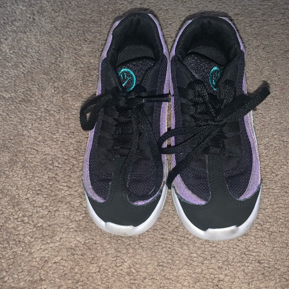 Black, pink and purple Nike’s